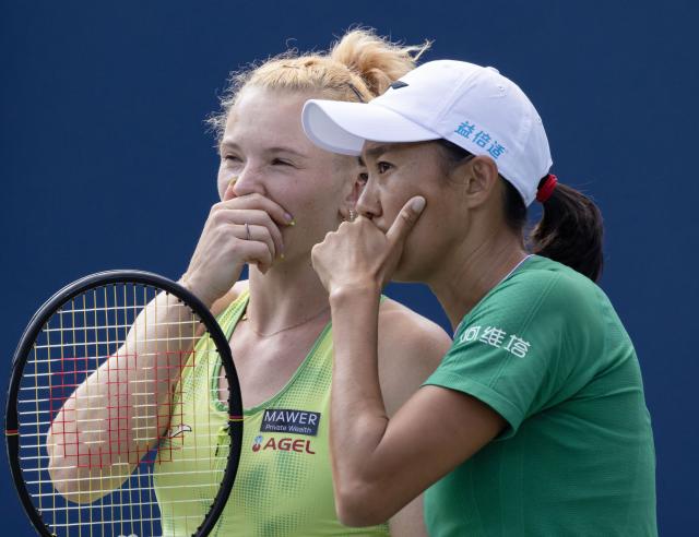 (260814) -- TORONTO, Aug. 14, 2026 (Xinhua) -- Zhang Shuai (R)/Katerina Siniakova talk to each other during the women's doubles final match between Zhang Shuai(China) / Katerina Siniakova(the Czech Republic) and Sara Errani(Italy)/Nicole Melichar-Martinez(the United States) at the 2026 National Bank Open tennis tournament in Toronto, Canada, Aug. 13, 2026. (Photo by Zou Zheng/Xinhua)