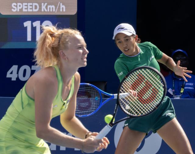(260814) -- TORONTO, Aug. 14, 2026 (Xinhua) -- Zhang Shuai (R)/Katerina Siniakova compete during the women's doubles final match between Zhang Shuai(China) / Katerina Siniakova(the Czech Republic) and Sara Errani(Italy)/Nicole Melichar-Martinez(the United States) at the 2026 National Bank Open tennis tournament in Toronto, Canada, Aug. 13, 2026. (Photo by Zou Zheng/Xinhua)