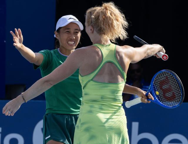 (260814) -- TORONTO, Aug. 14, 2026 (Xinhua) -- Zhang Shuai (L)/Katerina Siniakova celebrate victory after the women's doubles final match between Zhang Shuai(China) / Katerina Siniakova(the Czech Republic) and Sara Errani(Italy)/Nicole Melichar-Martinez(the United States) at the 2026 National Bank Open tennis tournament in Toronto, Canada, Aug. 13, 2026. (Photo by Zou Zheng/Xinhua)