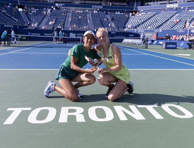 (260814) -- TORONTO, Aug. 14, 2026 (Xinhua) -- Zhang Shuai (L)/Katerina Siniakova pose for photos with the trophy during the awarding ceremony after the women's doubles final match between Zhang Shuai(China) / Katerina Siniakova(the Czech Republic) and Sara Errani(Italy)/Nicole Melichar-Martinez(the United States) at the 2026 National Bank Open tennis tournament in Toronto, Canada, Aug. 13, 2026. (Photo by Zou Zheng/Xinhua)