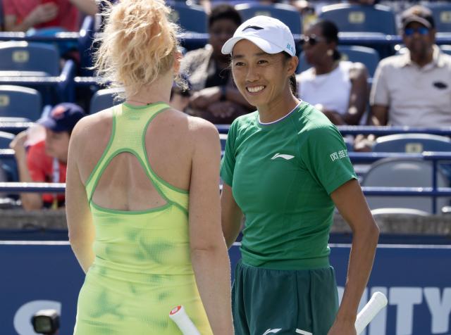 (260814) -- TORONTO, Aug. 14, 2026 (Xinhua) -- Zhang Shuai (R)/Katerina Siniakova celebrate scoring during the women's doubles final match between Zhang Shuai(China) / Katerina Siniakova(the Czech Republic) and Sara Errani(Italy)/Nicole Melichar-Martinez(the United States) at the 2026 National Bank Open tennis tournament in Toronto, Canada, Aug. 13, 2026. (Photo by Zou Zheng/Xinhua)