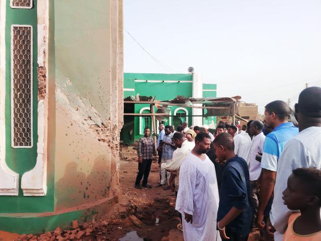 (260814) -- AL-DROSHAB, Aug. 14, 2026 (Xinhua) -- This photo taken with a mobile phone shows residents inspecting a drone-attacked mosque in Al-Droshab, north of Sudan's capital Khartoum on Aug. 12, 2026.
  Drone attacks continued across Sudan on Thursday for a second consecutive day, targeting the capital Khartoum and several other cities as fighting intensified on multiple fronts in the Kordofan and Blue Nile regions. (Photo by Mohamed Khidir/Xinhua)