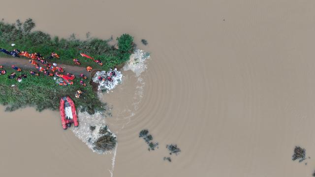 (260814) -- BEIJING, Aug. 14, 2026 (Xinhua) -- An aerial drone photo shows repair work underway at the site of a levee breach along the Beiru River in Jiaxian County, central China's Henan Province, Aug. 13, 2026.
  Thousands of people have been evacuated in Henan Province after days of torrential rain swelled rivers and triggered a levee breach, local authorities said Thursday.
  In Pingdingshan City, more than 2,000 people were relocated to safety after a levee along the Beiru River in Jiaxian County gave way on Wednesday night, following extreme rainfall and large-volume discharges from upstream reservoirs. No casualties have been reported so far. (Xinhua/Yang Jinxin)