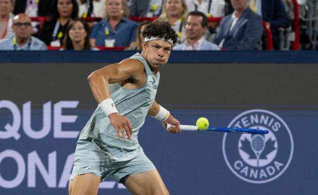 (260814) -- MONTREAL, Aug. 14, 2026 (Xinhua) -- Ben Shelton returns the ball during the men's singles final match between Ben Shelton of the United States and Brandon Nakashima of the United States at the 2026 National Bank Open tennis tournament in Montreal, Canada, Aug. 13, 2026. (Photo by Li Haitao/Xinhua)