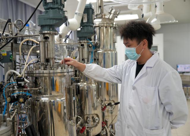 (260814) -- CHANGDE, Aug. 14, 2026 (Xinhua) -- A staff member works at a fermentation room of the Hunan Lier Biotech Co., Ltd. in Jinshi City of Changde, central China's Hunan Province, on Aug. 13, 2026. In recent years, Jinshi City has stepped up efforts to develop its bio-manufacturing industry which dates back to the 1950s. The city is now home to 41 relevant companies engaged in fields including bio-agriculture, bio-pharmaceuticals and bio-food, with more than 200 high-end synthetic biology products in production. 
   In the first half of this year, the bio-manufacturing industry generated an output value of 2.09 billion yuan (about 310 million U.S. dollars), providing fresh impetus to the local economy. (Xinhua/Dai Mingxuan)