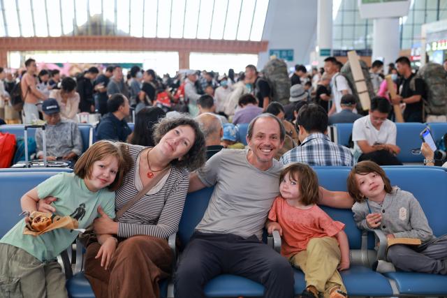 (260814) -- KUNMING, Aug. 14, 2026 (Xinhua) -- French tourists are seen at Kunming South Railway Station in Kunming, southwest China's Yunnan Province, Aug. 14, 2026. With its cool plateau climate, Yunnan has become a popular summer destination for domestic and international tourists.
During the summer travel season, Yunnan has increased its railway transportation capacity on routes connecting Kunming with popular tourist cities. (Photo by Yang Zixuan/Xinhua)