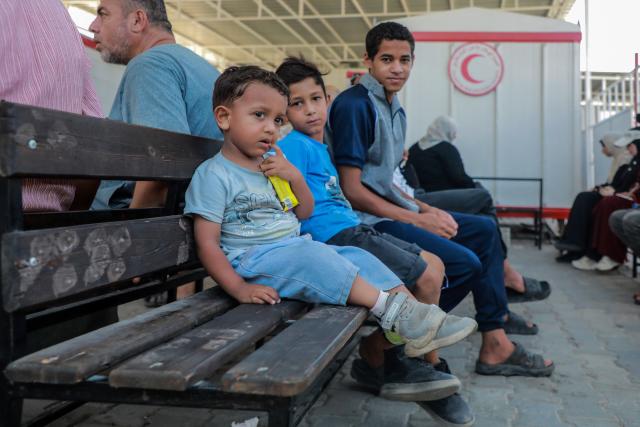 (260814) -- GAZA, Aug. 14, 2026 (Xinhua) -- Palestinian patients wait to receive treatment at a field hospital run by the Palestinian Red Crescent Society in central Gaza City on Aug. 11, 2026. TO GO WITH "Feature: Amid sewage swamps and dilapidated tents, displaced Gazans besieged by skin diseases" (Photo by Rizek Abdeljawad/Xinhua)