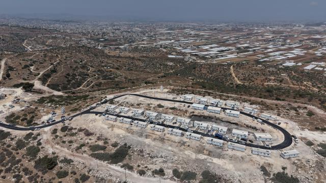 (260814) -- JERUSALEM, Aug. 14, 2026 (Xinhua) -- An aerial drone photo taken on Aug. 13, 2026 shows the West Bank settlement of Ganim.
  Four settlements in the West Bank, including Ganim, were evacuated in 2005 as part of Israel's "Disengagement Plan". The Ganim settlement has now been re-established, 21 years after its evacuation. (Photo by Gil Cohen Magen/Xinhua)