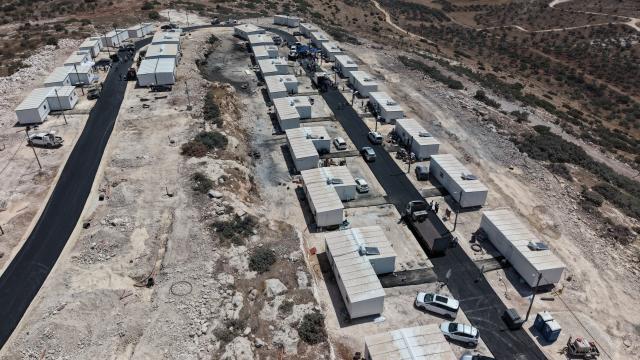 (260814) -- JERUSALEM, Aug. 14, 2026 (Xinhua) -- An aerial drone photo taken on Aug. 13, 2026 shows the West Bank settlement of Ganim.
  Four settlements in the West Bank, including Ganim, were evacuated in 2005 as part of Israel's "Disengagement Plan". The Ganim settlement has now been re-established, 21 years after its evacuation. (Photo by Gil Cohen Magen/Xinhua)