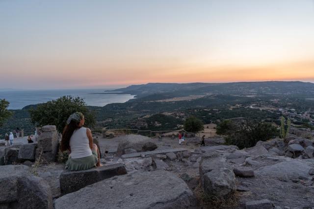 (260814) -- CANAKKALE, Aug. 14, 2026 (Xinhua) -- People visit the Archaeological Site of Assos in Canakkale Province, Türkiye, Aug. 12, 2026. The ancient city of Assos is a popular tourist destination along the Aegean coast, known for its ancient ruins. The Archaeological Site of Assos was included on UNESCO's tentative list of World Heritage Sites in 2017. (Xinhua/Cheng Ruize)
