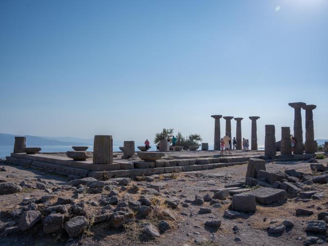 (260814) -- CANAKKALE, Aug. 14, 2026 (Xinhua) -- People visit the ruins of the Temple of Athena at the Archaeological Site of Assos in Canakkale Province, Türkiye, Aug. 12, 2026. The ancient city of Assos is a popular tourist destination along the Aegean coast, known for its ancient ruins. The Archaeological Site of Assos was included on UNESCO's tentative list of World Heritage Sites in 2017. (Xinhua/Cheng Ruize)