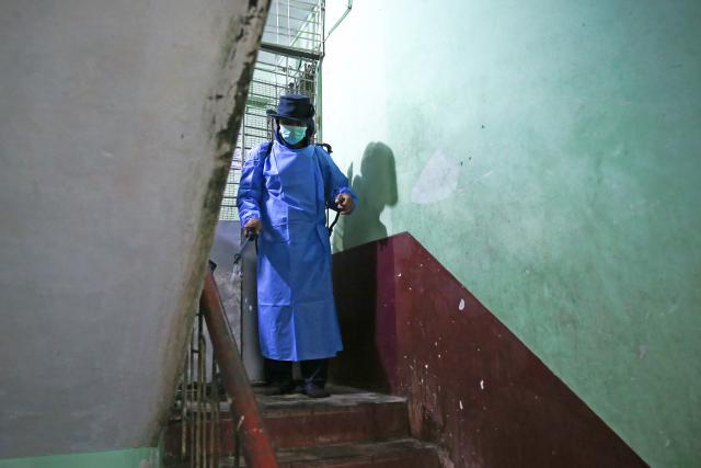 (260814) -- YANGON, Aug. 14, 2026 (Xinhua) -- A health worker sanitizes an apartment in Yangon, Myanmar, Aug. 14, 2026. More than 90 people have tested positive for Vibrio cholerae in Myanmar's Yangon region, the Ministry of Health said Thursday. (Xinhua/Myo Kyaw Soe)