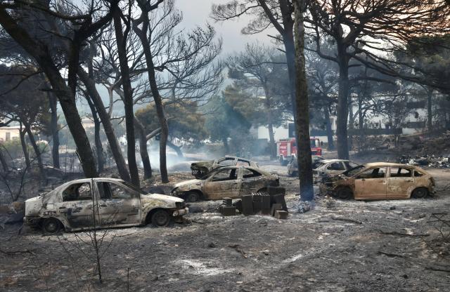 (260814) -- OMIS, Aug. 14, 2026 (Xinhua) -- Photo taken on Aug. 14, 2026 shows the aftermath of a wildfire near the southern Croatian town of Omis. A body has been found at the site of a massive wildfire that swept through wooded and residential areas in Omis, Croatia overnight, and the number of people injured in the fire rose to 40, police confirmed on Friday. (Ivo Cagalj/PIXSELL via Xinhua)