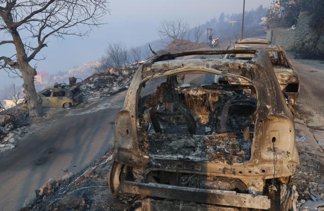 (260814) -- OMIS, Aug. 14, 2026 (Xinhua) -- Photo taken on Aug. 14, 2026 shows the aftermath of a wildfire near the southern Croatian town of Omis. A body has been found at the site of a massive wildfire that swept through wooded and residential areas in Omis, Croatia overnight, and the number of people injured in the fire rose to 40, police confirmed on Friday. (Ivo Cagalj/PIXSELL via Xinhua)
