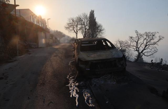 (260814) -- OMIS, Aug. 14, 2026 (Xinhua) -- Photo taken on Aug. 14, 2026 shows the aftermath of a wildfire near the southern Croatian town of Omis. A body has been found at the site of a massive wildfire that swept through wooded and residential areas in Omis, Croatia overnight, and the number of people injured in the fire rose to 40, police confirmed on Friday. (Ivo Cagalj/PIXSELL via Xinhua)