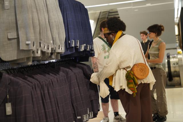 (260814) -- NEW YORK, Aug. 14, 2026 (Xinhua) -- People shop at a store in New York, the United States, Aug. 14, 2026. U.S. consumer sentiment weakened materially in August from July as consumers worried about rising living costs due to the conflict in the Middle East, a survey showed Friday. A separate report from the U.S. Census Bureau on Friday showed that U.S. retail sales posted their first month-on-month decline in nine months. (Xinhua/Zhang Fengguo)