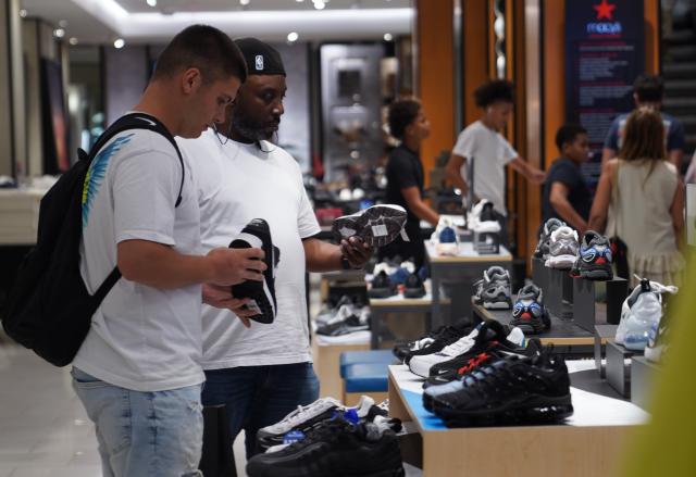 (260814) -- NEW YORK, Aug. 14, 2026 (Xinhua) -- People shop at a store in New York, the United States, Aug. 14, 2026. U.S. consumer sentiment weakened materially in August from July as consumers worried about rising living costs due to the conflict in the Middle East, a survey showed Friday. A separate report from the U.S. Census Bureau on Friday showed that U.S. retail sales posted their first month-on-month decline in nine months. (Xinhua/Zhang Fengguo)
