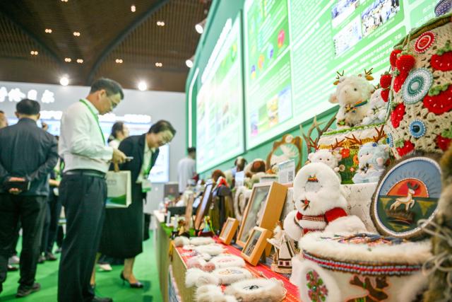 (260815) -- HULUNBUIR, Aug. 15, 2026 (Xinhua) -- Visitors view exhibits during a main event of the fourth National Ecology Day in Hulunbuir, north China's Inner Mongolia Autonomous Region, Aug. 15, 2026.
  China's top legislature designated Aug. 15 as National Ecology Day in 2023 to raise public awareness of ecological conservation and encourage action to protect the environment. (Xinhua/Lian Zhen)