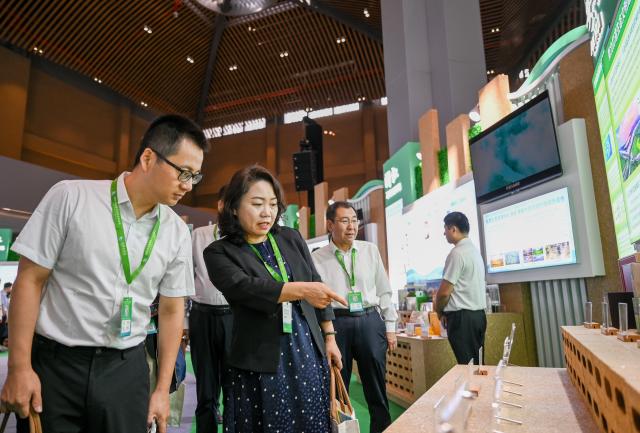 (260815) -- HULUNBUIR, Aug. 15, 2026 (Xinhua) -- Visitors view exhibits during a main event of the fourth National Ecology Day in Hulunbuir, north China's Inner Mongolia Autonomous Region, Aug. 15, 2026.
  China's top legislature designated Aug. 15 as National Ecology Day in 2023 to raise public awareness of ecological conservation and encourage action to protect the environment. (Xinhua/Lian Zhen)