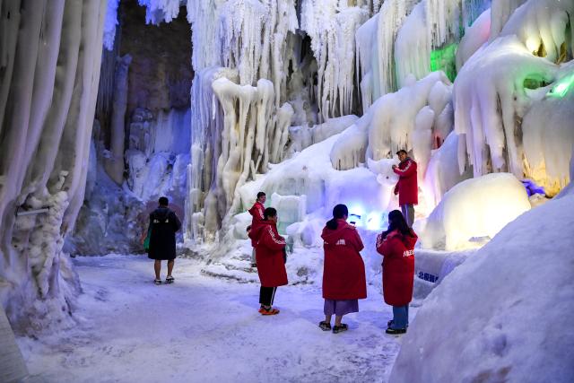 (260815) -- NANNING, Aug. 15, 2026 (Xinhua) -- Tourists visit a cave in Chongzuo, south China's Guangxi Zhuang Autonomous Region, May 30, 2026. In recent years, Guangxi has tapped the tourism potential of its caves, developing them into popular attractions while ensuring visitor safety. (Xinhua/Cao Yiming)
