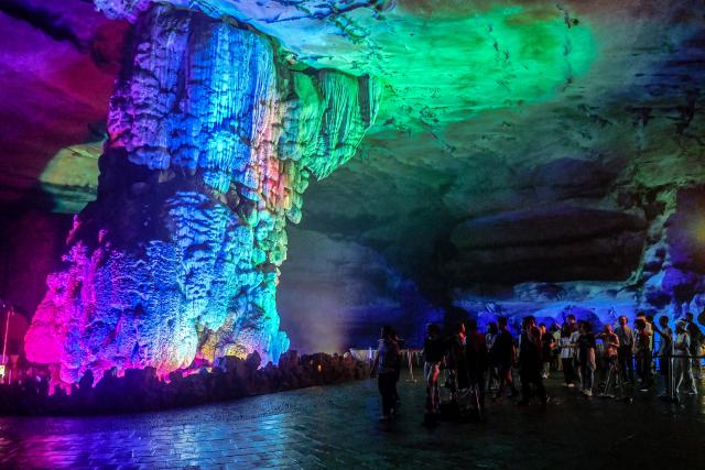 (260815) -- NANNING, Aug. 15, 2026 (Xinhua) -- Tourists visit a cave in Guilin, south China's Guangxi Zhuang Autonomous Region, Aug. 12, 2026. In recent years, Guangxi has tapped the tourism potential of its caves, developing them into popular attractions while ensuring visitor safety. (Xinhua/Zhang Ailin)