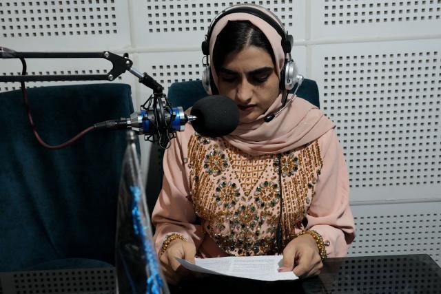 (260815) -- HERAT, Aug. 15, 2026 (Xinhua) -- A woman works at a radio station in Herat, Afghanistan, Aug. 9, 2026.
  TO GO WITH "Feature: Working outside home a remedy to women suffering from depression in W. Afghanistan" (Photo by Saifurahman Safi/Xinhua)