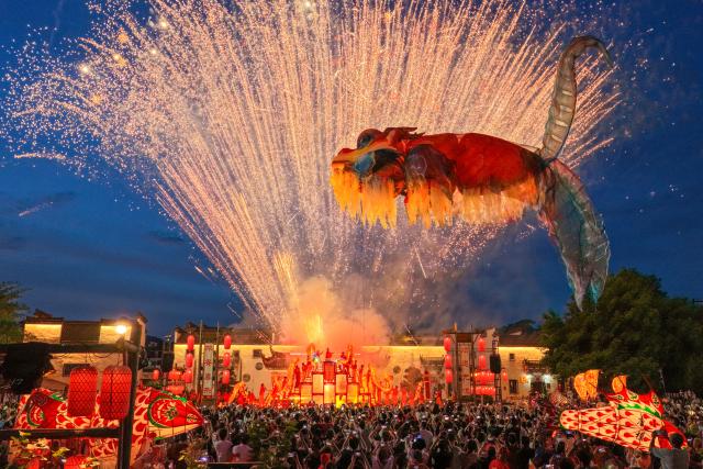 (260815) -- HEFEI, Aug. 15, 2026 (Xinhua) -- A drone photo shows a fish lantern parade staged in Tangmo Village of Huizhou District in Huangshan City, east China's Anhui Province, July 16, 2026. (Photo by Shi Yalei/Xinhua)