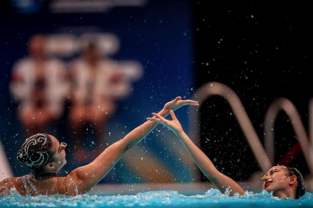 (260815) -- BUDAPEST, Aug. 15, 2026 (Xinhua) -- He Zhien/Zhou Kunyi (R) of China perform during the Women's Duet Free Event of the World Aquatics Junior Artistic Swimming Championships in Budapest, Hungary, Aug. 15, 2026. (Photo by David Balogh/Xinhua)