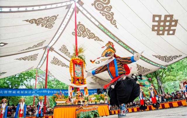 (260815) -- LHASA, Aug. 15, 2026 (Xinhua) -- Artists stage a Tibetan opera during the Shoton Festival in Lhasa, southwest China's Xizang Autonomous Region, Aug. 15, 2026. Tibetan opera blends talking, singing, acting, dancing and literature, which is a must-see performance for visitors during the Shoton Festival. (Xinhua/Tenzin Nyida)