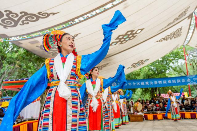 (260815) -- LHASA, Aug. 15, 2026 (Xinhua) -- Artists stage a Tibetan opera during the Shoton Festival in Lhasa, southwest China's Xizang Autonomous Region, Aug. 15, 2026. Tibetan opera blends talking, singing, acting, dancing and literature, which is a must-see performance for visitors during the Shoton Festival. (Xinhua/Tenzin Nyida)