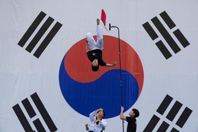 (260815) -- SEOUL, Aug. 15, 2026 (Xinhua) -- Members of Seodaemun Taekwondo Demonstration team perform during the Liberation Day at the Seodaemun Independence Park in Seoul, South Korea, Aug. 15, 2026. August 15 is observed as the Liberation Day every year which marks the Korean Peninsula's liberation from Japanese colonial rule. (Photo by Jun Hyosang/Xinhua)