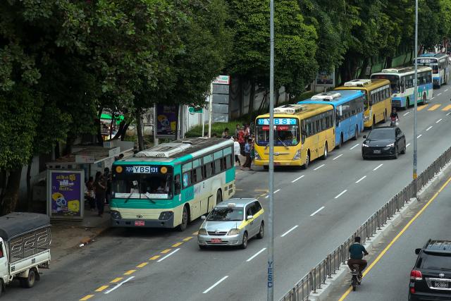 (260815) -- YANGON, Aug. 15, 2026 (Xinhua) -- Yangon Bus Service (YBS) buses pull into a bus station in Yangon, Myanmar, Aug. 15, 2026. Public bus fares on the Yangon Bus Service (YBS) routes, the main public bus network in Yangon, will increase from Sept. 1 to address rising costs of vehicle spare parts and maintenance, the state-owned daily The Global New Light of Myanmar reported Saturday. (Xinhua/Myo Kyaw Soe)