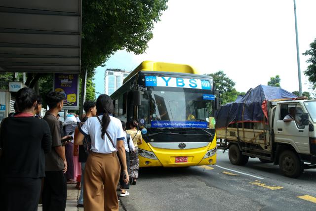 (260815) -- YANGON, Aug. 15, 2026 (Xinhua) -- People get on a Yangon Bus Service (YBS) bus in Yangon, Myanmar, Aug. 15, 2026. Public bus fares on the Yangon Bus Service (YBS) routes, the main public bus network in Yangon, will increase from Sept. 1 to address rising costs of vehicle spare parts and maintenance, the state-owned daily The Global New Light of Myanmar reported Saturday. (Xinhua/Myo Kyaw Soe)