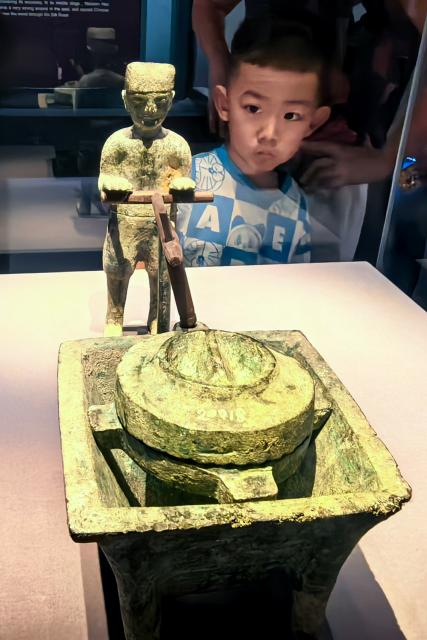 (260815) -- WUHAN, Aug. 15, 2026 (Xinhua) -- A child visits the Jingzhou Museum in Jingzhou City, central China's Hubei Province, Aug. 15, 2026. Museums in Hubei Province have seen a surging number of children and teenagers on study tours during the summer vacation. With guided tours, hands-on experiences, and intangible cultural heritage classes, these museums are offering more than just exhibitions to enrich the summer life of children and students. (Xinhua/Shen Hongbing)