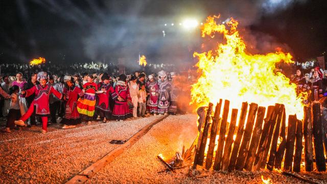 (260815) -- GUIYANG, Aug. 15, 2026 (Xinhua) -- Visitors and local people enjoy themselves around a bonfire in Yi-Hui-Miao Autonomous County of Weining, Bijie, southwest China's Guizhou Province, Aug. 6, 2026. The cool climate and rich tourism resources in Guizhou have attracted lots of visitors seeking a summer retreat. (Xinhua/Tao Liang)