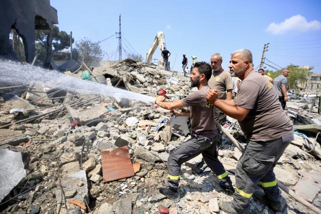 (260815) -- DEIR AL ZAHRANI, Aug. 15, 2026 (Xinhua) -- Firefighters put out a fire following Israeli airstrikes in Deir Al Zahrani, southern Lebanon, Aug. 15, 2026. Lebanese broadcaster Al-Jadeed TV reported that four people were killed and nine others wounded after an Israeli airstrike hit a two-story building in the town of Deir Al Zahrani in the Nabatieh District. (Photo by Ali Hashisho/Xinhua)