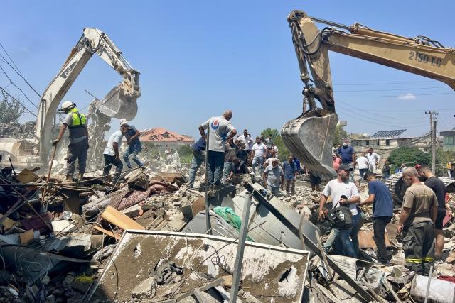 (260815) -- DEIR AL ZAHRANI, Aug. 15, 2026 (Xinhua) -- Rescuers search through the rubble of buildings hit by Israeli airstrikes in Deir Al Zahrani, southern Lebanon, Aug. 15, 2026. Lebanese broadcaster Al-Jadeed TV reported that four people were killed and nine others wounded after an Israeli airstrike hit a two-story building in the town of Deir Al Zahrani in the Nabatieh District. (Photo by Ali Hashisho/Xinhua)