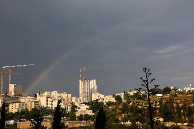 (260815) -- JERUSALEM, Aug. 15, 2026 (Xinhua) -- A rainbow appears over Jerusalem after heavy downpours, Aug. 15, 2026. Rare heavy downpours trigger mountain flash floods and urban waterlogging across Jerusalem on Saturday. The region is currently in midsummer, a period typically marked by extreme drought and almost zero precipitation. (Photo by Gil Cohen Magen/Xinhua)