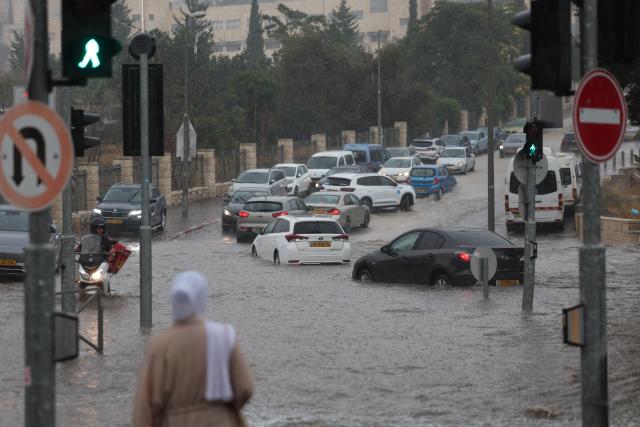 (260815) -- JERUSALEM, Aug. 15, 2026 (Xinhua) -- Photo taken on Aug. 15, 2026 shows a flooded road section in Jerusalem. Rare heavy downpours trigger mountain flash floods and urban waterlogging across Jerusalem on Saturday. The region is currently in midsummer, a period typically marked by extreme drought and almost zero precipitation. (Photo by Jamal Awad/Xinhua)