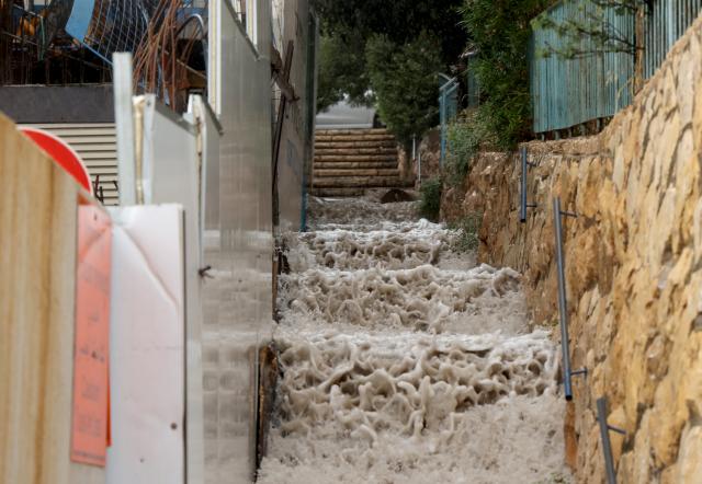 (260815) -- JERUSALEM, Aug. 15, 2026 (Xinhua) -- Photo taken on Aug. 15, 2026 shows a flooded area in Jerusalem. Rare heavy downpours trigger mountain flash floods and urban waterlogging across Jerusalem on Saturday. The region is currently in midsummer, a period typically marked by extreme drought and almost zero precipitation. (Photo by Gil Cohen Magen/Xinhua)