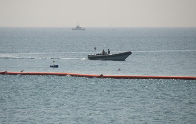 (260815) -- CEUTA, Aug. 15, 2026 (Xinhua) -- A maritime barrier installed by Spanish authorities is seen in Ceuta, Spain, Aug. 15, 2026. More than 72,000 migrants crossed irregularly into Ceuta from neighboring Morocco on July 30 and 31, according to the Spanish government. Most returned to Morocco later, while thousands remain in the enclave.Security was also tightened along the border ahead of Saturday after calls for another mass crossing circulated on social media. Moroccan security forces intercepted hundreds of migrants attempting to reach the border area, while Ceuta reported no influx on a scale comparable to that seen in late July. (Xinhua/Cheng Min)