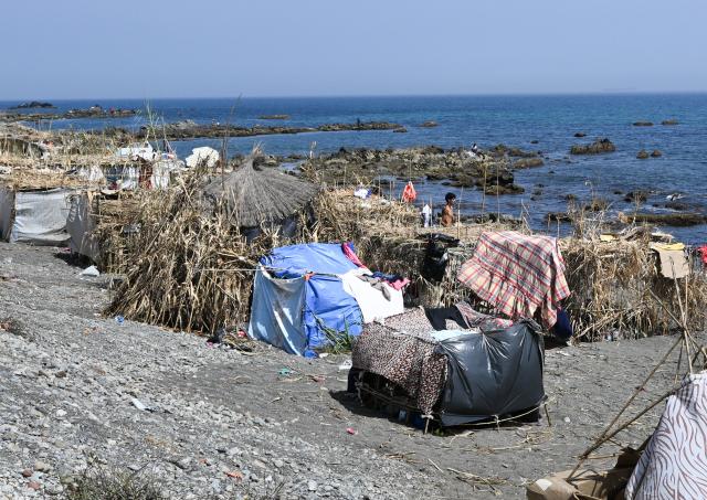 (260815) -- CEUTA, Aug. 15, 2026 (Xinhua) -- Makeshift shelters are seen on Trampolin Beach in Ceuta, Spain, Aug. 15, 2026. More than 72,000 migrants crossed irregularly into Ceuta from neighboring Morocco on July 30 and 31, according to the Spanish government. Most returned to Morocco later, while thousands remain in the enclave.Security was also tightened along the border ahead of Saturday after calls for another mass crossing circulated on social media. Moroccan security forces intercepted hundreds of migrants attempting to reach the border area, while Ceuta reported no influx on a scale comparable to that seen in late July. (Xinhua/Cheng Min)
