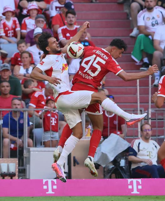 (260816) -- MUNICH, Aug. 16, 2026 (Xinhua) -- Aleksandar Pavlovic (R) of Bayern Munich vies with Max Finkgraefe of RB Leipzig during a friendly football match between Bayern Munich and RB Leipzig in Munich, Germany, Aug. 15, 2026. (Photo by Philippe Ruiz/Xinhua)