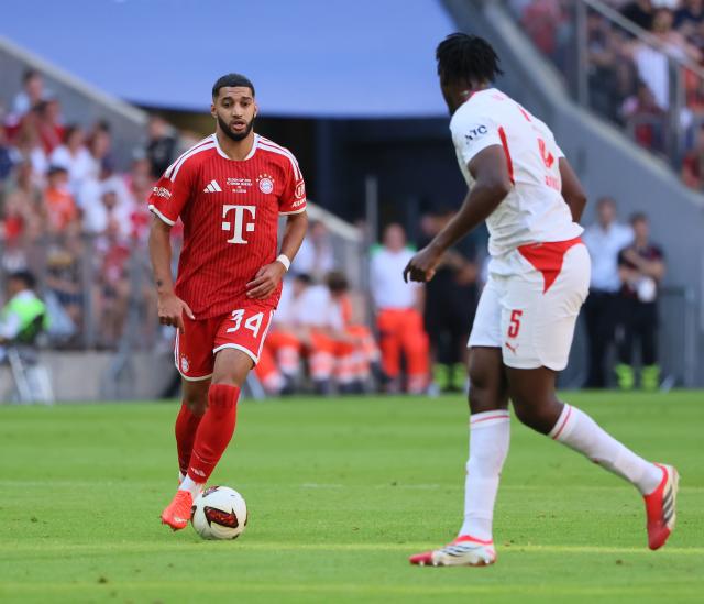 (260816) -- MUNICH, Aug. 16, 2026 (Xinhua) -- Ismael Saibari (L) of Bayern Munich vies with Chadaille Bitshiabu of RB Leipzig during a friendly football match between Bayern Munich and RB Leipzig in Munich, Germany, Aug. 15, 2026. (Photo by Philippe Ruiz/Xinhua)