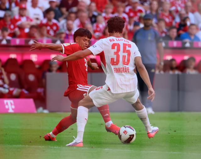 (260816) -- MUNICH, Aug. 16, 2026 (Xinhua) -- Maycon Cardozo (L) of Bayern Munich vies with Max Finkgraefe of RB Leipzig during a friendly football match between Bayern Munich and RB Leipzig in Munich, Germany, Aug. 15, 2026. (Photo by Philippe Ruiz/Xinhua)