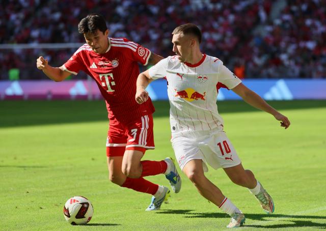 (260816) -- MUNICH, Aug. 16, 2026 (Xinhua) -- Min-Jae Kim (L) of Bayern Munich vies with Brajan Gruda of RB Leipzig during a friendly football match between Bayern Munich and RB Leipzig in Munich, Germany, Aug. 15, 2026. (Photo by Philippe Ruiz/Xinhua)