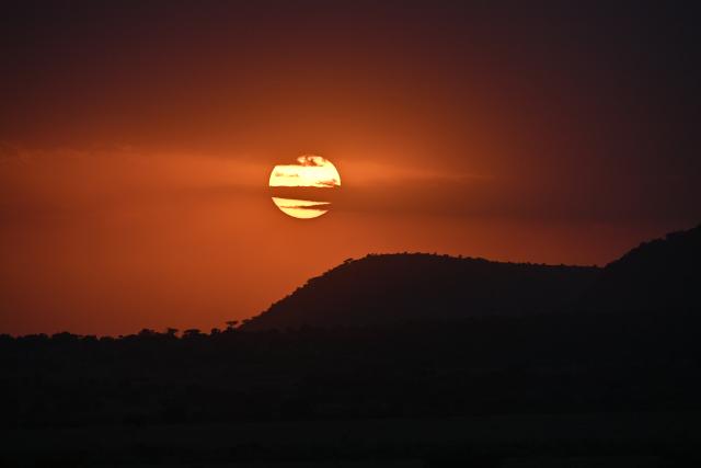 (260816) -- NAROK, Aug. 16, 2026 (Xinhua) -- This photo taken on Aug. 13, 2026 shows the sunset scenery in the Maasai Mara National Reserve in Narok, Kenya. The Great Wildebeest Migration is world-famous, but the Maasai Mara has more stories beyond the dramatic river crossings. Herds rest and gather strength. Plants grow and fade. All wildlife follows the rhythm of the savanna, sustaining this land's enduring life. (Xinhua/Liu Qiong)