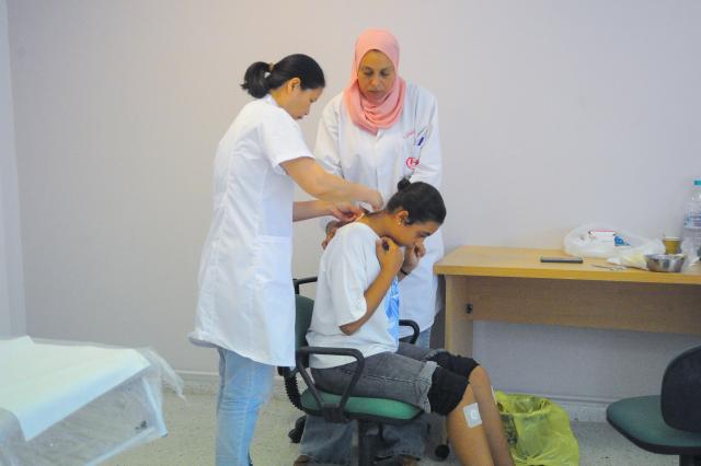 (260816) -- TUNIS, Aug. 16, 2026 (Xinhua) -- A doctor (L) administers Sanfutie, or Sanfu plaster, a centuries-old traditional Chinese medicine therapy, to a patient in Tunis, Tunisia, Aug. 14, 2026. The 30th Chinese medical team to Tunisia conducted Sanfutie treatments for the Tunisian people on Friday. (Photo by Adel Ezzine/Xinhua)