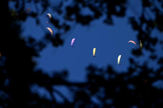 (260816) -- KRUSHEVO, Aug. 16, 2026 (Xinhua) -- Participants compete during the 18th World Air Sports Federation (FAI) European Paragliding Championships in Krushevo, North Macedonia, Aug.16, 2026. The event is taking place from Aug. 8 to 19, bringing together 130 of Europe's top pilots. (Photo by Tomislav Georgiev/Xinhua)