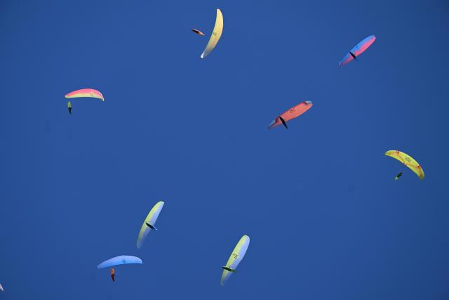 (260816) -- KRUSHEVO, Aug. 16, 2026 (Xinhua) -- Participants compete during the 18th World Air Sports Federation (FAI) European Paragliding Championships in Krushevo, North Macedonia, Aug.16, 2026. The event is taking place from Aug. 8 to 19, bringing together 130 of Europe's top pilots. (Photo by Tomislav Georgiev/Xinhua)